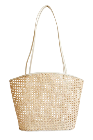 Cream handwoven rattan tote bag with leather straps and structured shape by Bembien