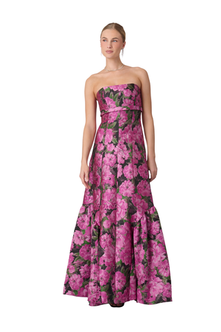 Shoshanna Nia Dress in Magenta Multi featuring floral jacquard, strapless fitted bodice, and floor-length flared skirt with ruffle detailing.