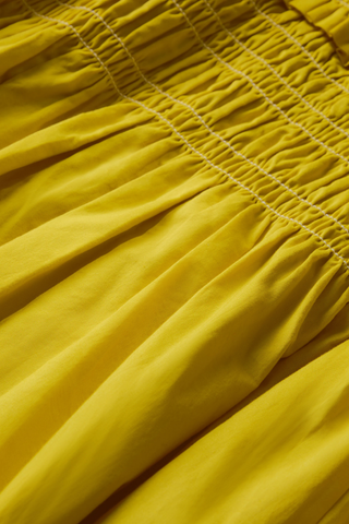 Marie Oliver Citrine yellow maxi dress with smocked waist and high gathered neckline