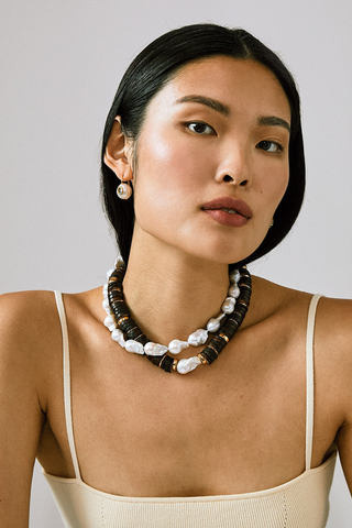 Lizzie Fortunato Bilbao II Collar in Brown featuring cocoa recycled bone heishi beads, gold-plated accents, and a baroque freshwater pearl.