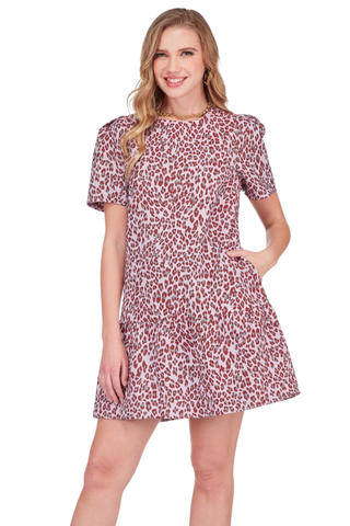 JoyJoy Flounce Dress in Blushing Leopard featuring a blush-toned leopard print, short sleeves, fitted bodice, and flounced mini hem.