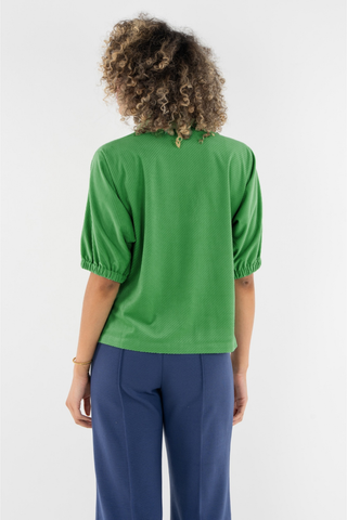Emily McCarthy Bonny Top in Winter Pine featuring a vibrant green color, collared neckline, button front, and short puff sleeves.