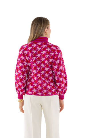 Emily McCarthy Lolli Sweater in Houndstooth featuring a vibrant pink and red houndstooth pattern, V-neckline, and long sleeves.