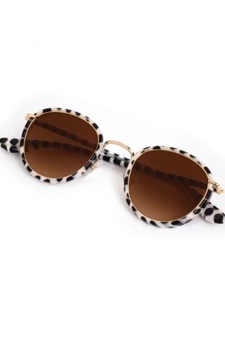 KREWE Tate Sunglasses in Domino 18K featuring round black-and-ivory acetate frames with amber gradient lenses and gold-plated hardware