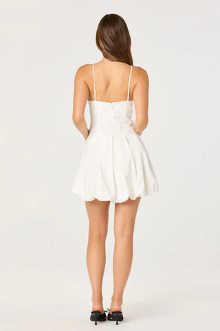 ASTR Tionna Dress in white featuring a square neckline, bow strap details, fitted bodice, and flared mini skirt