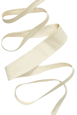 ADA Collection bone wrap leather belt styled tied at the waist over neutral dress