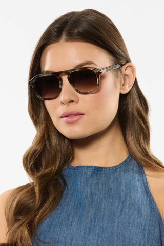 Zander Sunglasses in Aquamarine Tortoise from Krewe shown on a female model.